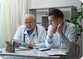 Two GP doctors talking to each other
